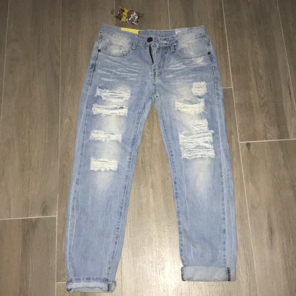 Stylish light blue ripped jeans